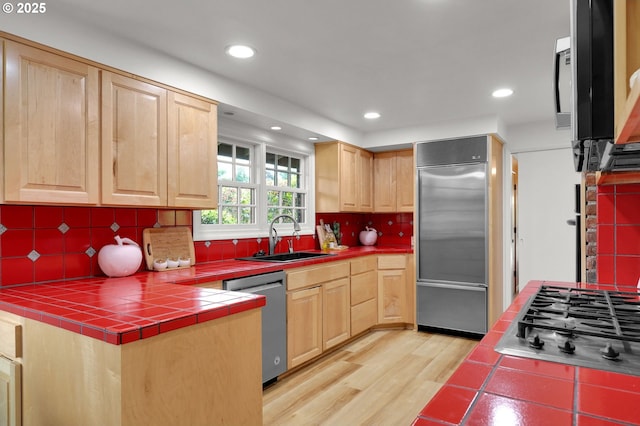996 Lariat Dr, Eugene, OR 97401 - kitchen featuring appliances with stainless steel finishes, a sink, light brown cabinets, tile countertops, and recessed lighting