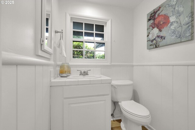 996 Lariat Dr, Eugene, OR 97401 - half bath with toilet, vanity, and wainscoting