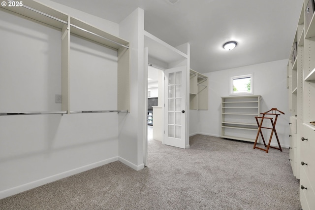996 Lariat Dr, Eugene, OR 97401 - walk in closet with carpet floors and french doors