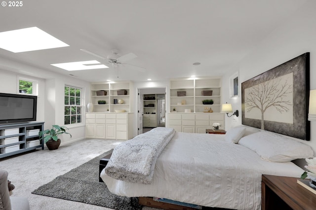 996 Lariat Dr, Eugene, OR 97401 - carpeted bedroom featuring a skylight, baseboards, and ceiling fan
