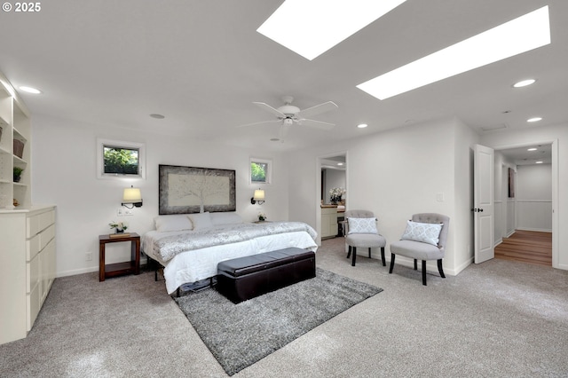 996 Lariat Dr, Eugene, OR 97401 - bedroom featuring light colored carpet, a skylight, recessed lighting, baseboards, and ceiling fan