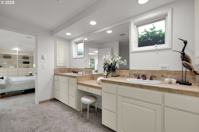 996 Lariat Dr, Eugene, OR 97401 - bathroom with connected bathroom, double vanity, recessed lighting, and decorative backsplash