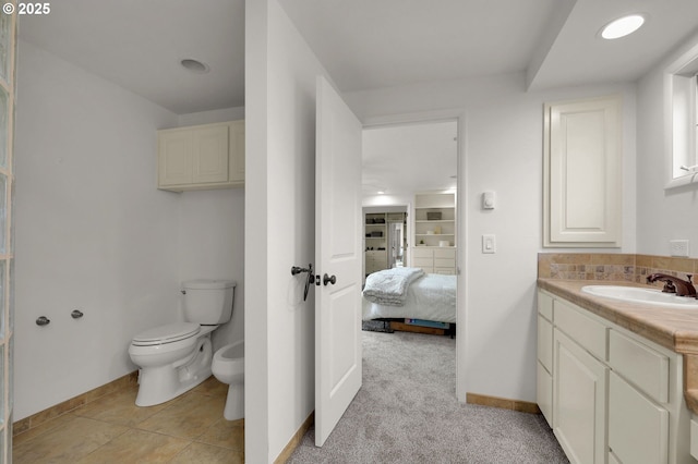 996 Lariat Dr, Eugene, OR 97401 - ensuite bathroom with vanity, baseboards, a bidet, and toilet