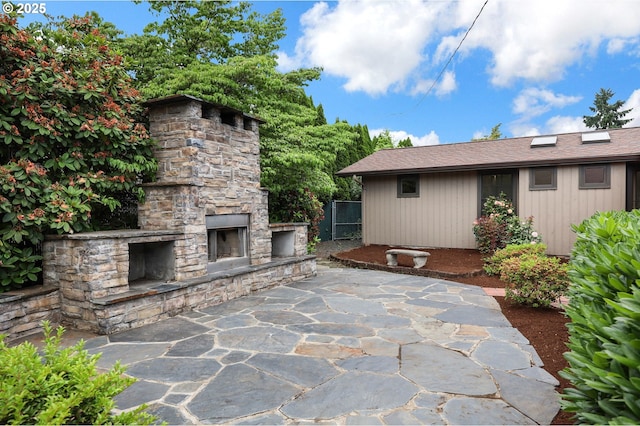 996 Lariat Dr, Eugene, OR 97401 - view of patio featuring an outdoor stone fireplace