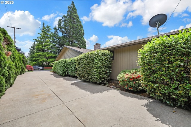 996 Lariat Dr, Eugene, OR 97401 - view of side of home with a chimney
