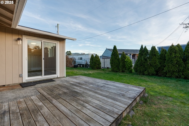 wooden terrace with a yard