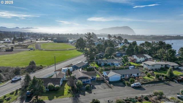 aerial view featuring a water and mountain view