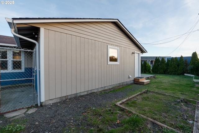 view of home's exterior with a yard