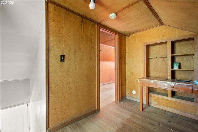 interior space featuring lofted ceiling and light wood-style flooring