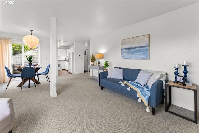 5858 S Riveridge Ln Unit 24, Portland, OR 97239 - living area featuring light colored carpet and baseboards