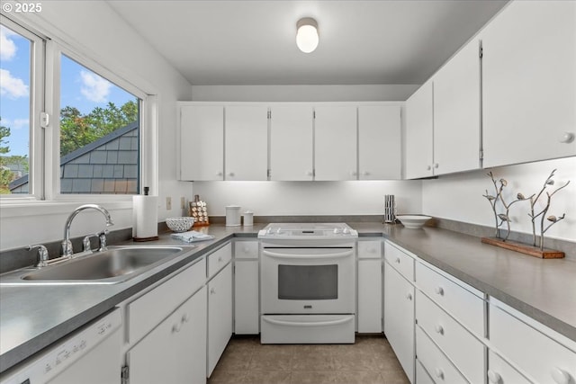 5858 S Riveridge Ln Unit 24, Portland, OR 97239 - kitchen with white appliances, white cabinetry, and light tile patterned flooring
