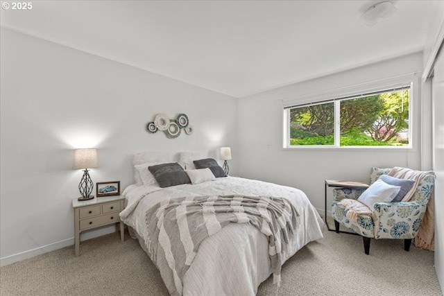 5858 S Riveridge Ln Unit 24, Portland, OR 97239 - bedroom with light colored carpet and baseboards