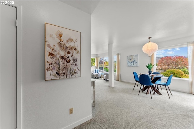 5858 S Riveridge Ln Unit 24, Portland, OR 97239 - carpeted dining space featuring baseboards