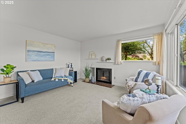 5858 S Riveridge Ln Unit 24, Portland, OR 97239 - carpeted living area with a fireplace with flush hearth and baseboards