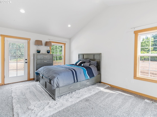 14300 NE Axford Rd, Battle Ground, WA 98604 - bedroom featuring lofted ceiling, access to exterior, baseboards, multiple windows, and carpet floors
