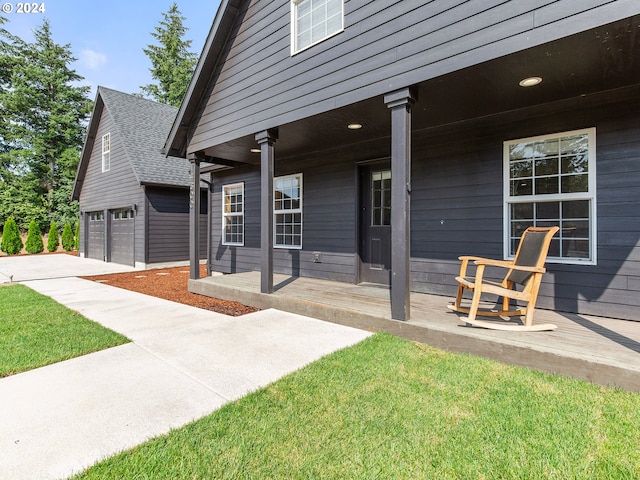 14300 NE Axford Rd, Battle Ground, WA 98604 - covered porch featuring a garage and an outdoor structure