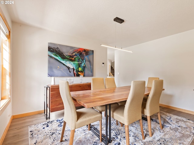 14300 NE Axford Rd, Battle Ground, WA 98604 - dining area featuring wood finished floors and baseboards