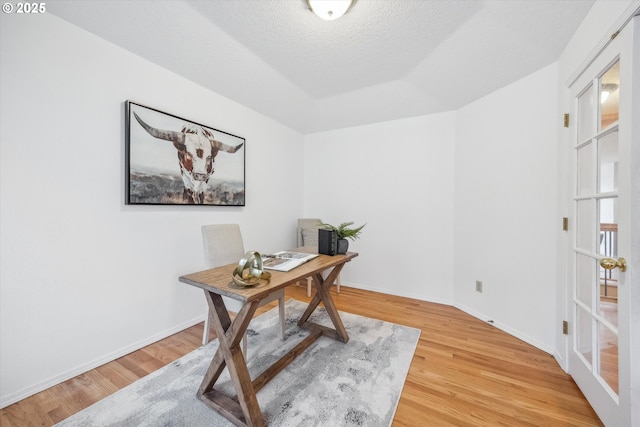 213 Hidalgo St, Lake Oswego, OR 97035 - office space with light wood-style flooring, baseboards, and a textured ceiling