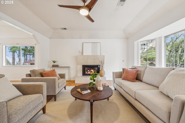 213 Hidalgo St, Lake Oswego, OR 97035 - living room with lofted ceiling, ceiling fan, a high end fireplace, and light wood finished floors