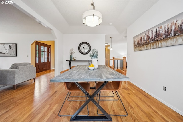 213 Hidalgo St, Lake Oswego, OR 97035 - dining area featuring arched walkways, light wood-style floors, and baseboards