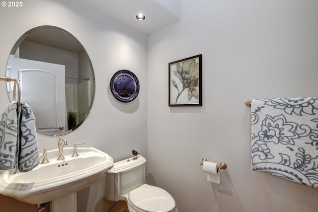 bathroom featuring sink and toilet