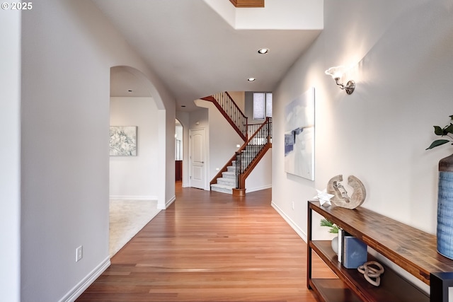 corridor with hardwood / wood-style floors