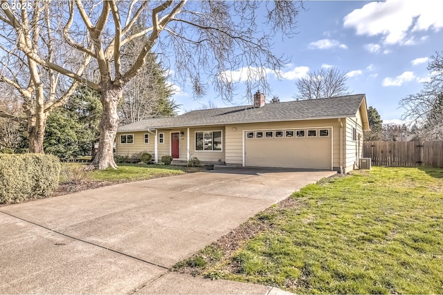 ranch-style home featuring fence, driveway, a chimney, a front lawn, and a garage