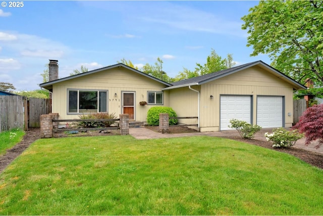 ranch-style house featuring driveway, a chimney, a front yard, fence, and an attached garage