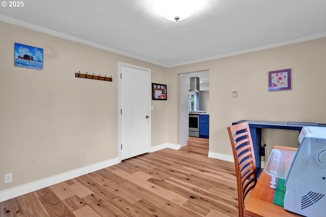 office featuring crown molding, baseboards, and wood finished floors
