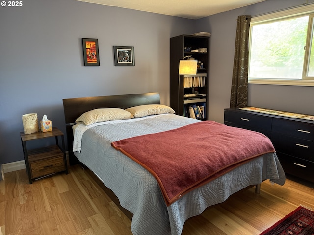bedroom featuring light wood-style floors