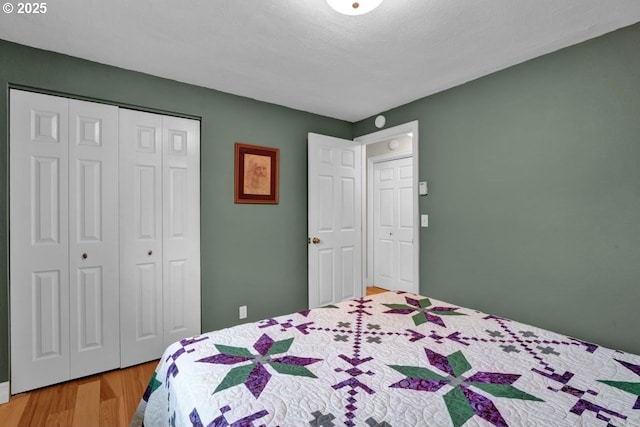 bedroom with a closet and wood finished floors
