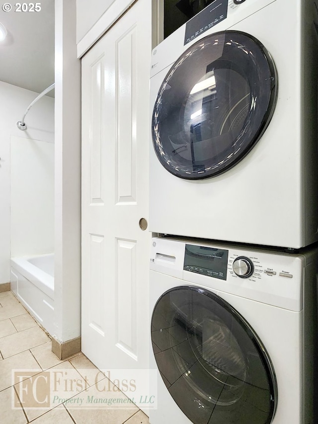 5516 NE Hoyt St, Portland, OR 97213 - laundry room with stacked washer / drying machine and light tile patterned floors