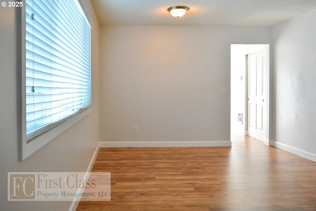 5516 NE Hoyt St, Portland, OR 97213 - empty room featuring wood finished floors and baseboards