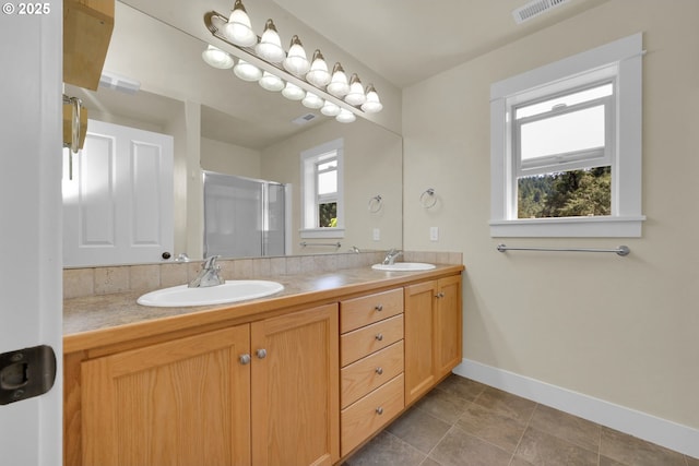 930 Kristen Way, Cottage Grove, OR 97424 - full bath with a sink, a stall shower, double vanity, and baseboards