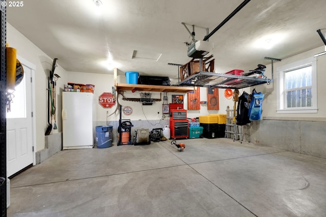 930 Kristen Way, Cottage Grove, OR 97424 - garage featuring freestanding refrigerator and a garage door opener