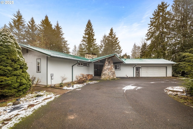 single story home with a garage