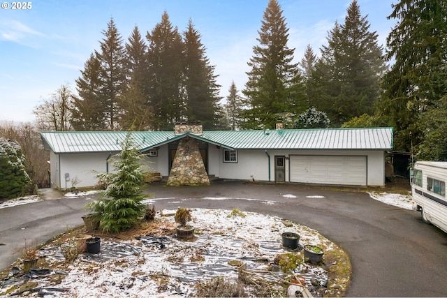 single story home with a garage