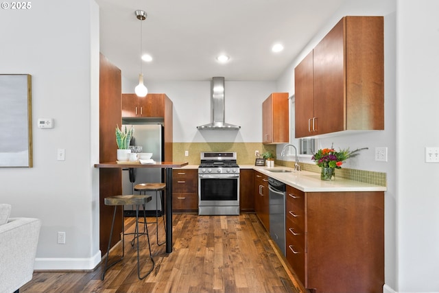 12842 Boones Ferry Rd, Lake Oswego, OR 97035 - kitchen with wall chimney exhaust hood, stainless steel appliances, a sink, dark wood-style flooring, and light countertops