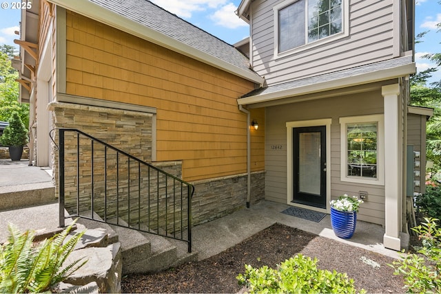 12842 Boones Ferry Rd, Lake Oswego, OR 97035 - property entrance with stone siding and roof with shingles
