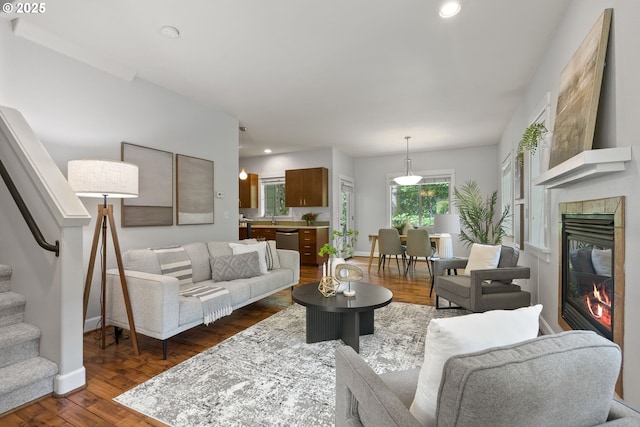 12842 Boones Ferry Rd, Lake Oswego, OR 97035 - living room featuring dark wood finished floors, baseboards, recessed lighting, a fireplace, and stairway