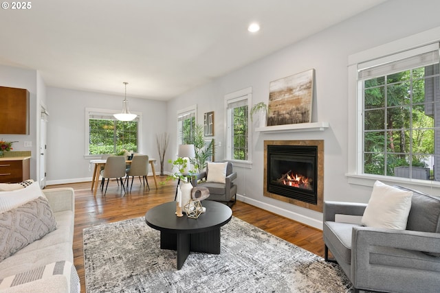 12842 Boones Ferry Rd, Lake Oswego, OR 97035 - living area with a tile fireplace, wood finished floors, recessed lighting, and baseboards