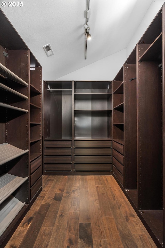 5210 SW Hewett Blvd, Portland, OR 97221 - walk in closet featuring dark wood finished floors and lofted ceiling