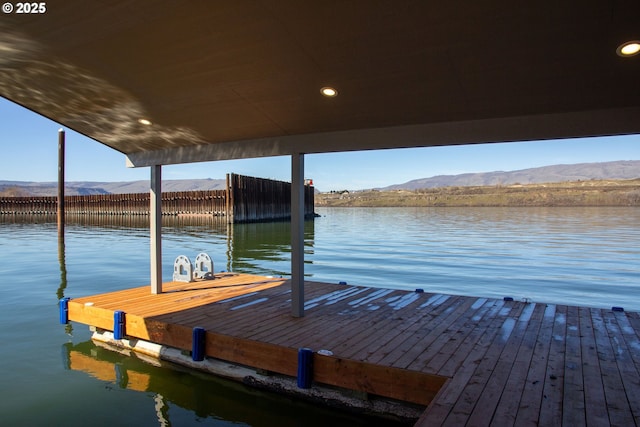 dock area with a water and mountain view