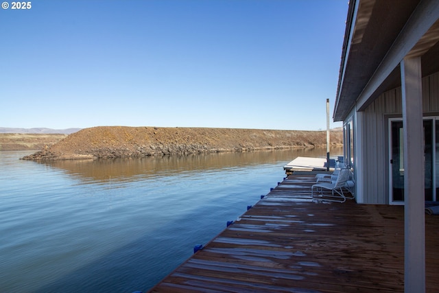 dock area with a water and mountain view