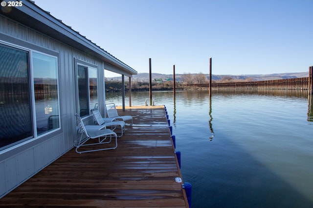 view of dock with a water view