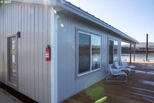 wooden deck with a water view