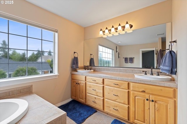 16436 Visionary Ct, Oregon City, OR 97045 - full bathroom with double vanity, a garden tub, and tile patterned floors