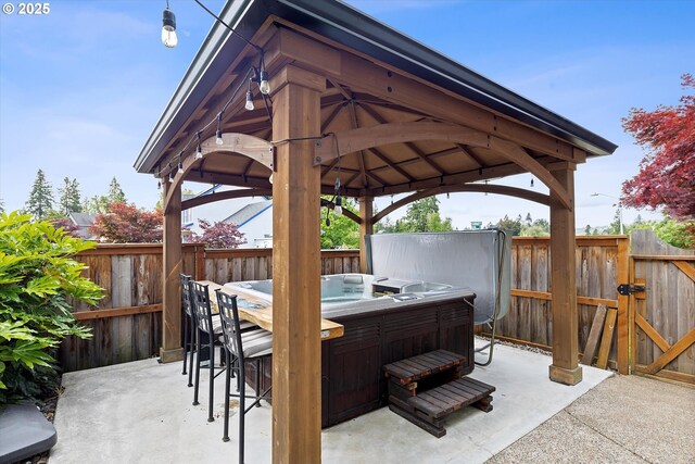 16436 Visionary Ct, Oregon City, OR 97045 - fenced backyard featuring a patio, a gazebo, and a hot tub