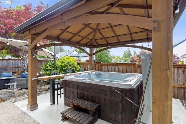 16436 Visionary Ct, Oregon City, OR 97045 - fenced backyard featuring a hot tub, a gazebo, and a patio