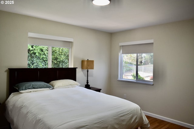29519 Crook St, Gold Beach, OR 97444 - bedroom featuring baseboards, multiple windows, and wood finished floors